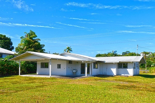 17-239 Volcano Road Keaau, HI 96749 - Photo 2 of 25 a front view of a house with a yard