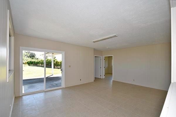 17-239 Volcano Road Keaau, HI 96749 - Photo 21 of 25 an empty room with wooden floor and windows
