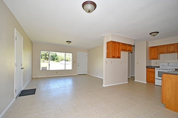 17-239 Volcano Road Keaau, HI 96749 - Photo 10 of 25 a view of a kitchen with a sink dishwasher and a refrigerator