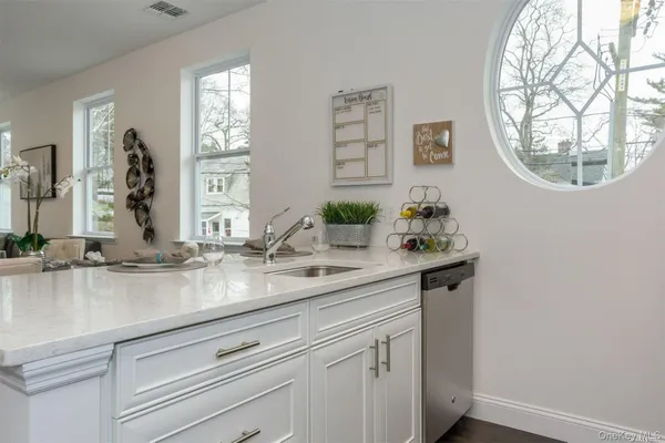 a sink with a mirror and vanity