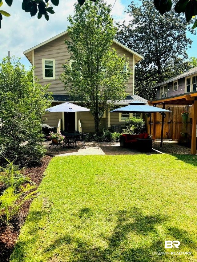 54 South Catherine Street Mobile, AL 36604 - Photo 49 of 55 Full view of backyard toward back of home shows off the lawn and patio and carport. This home is lovely and a must see!