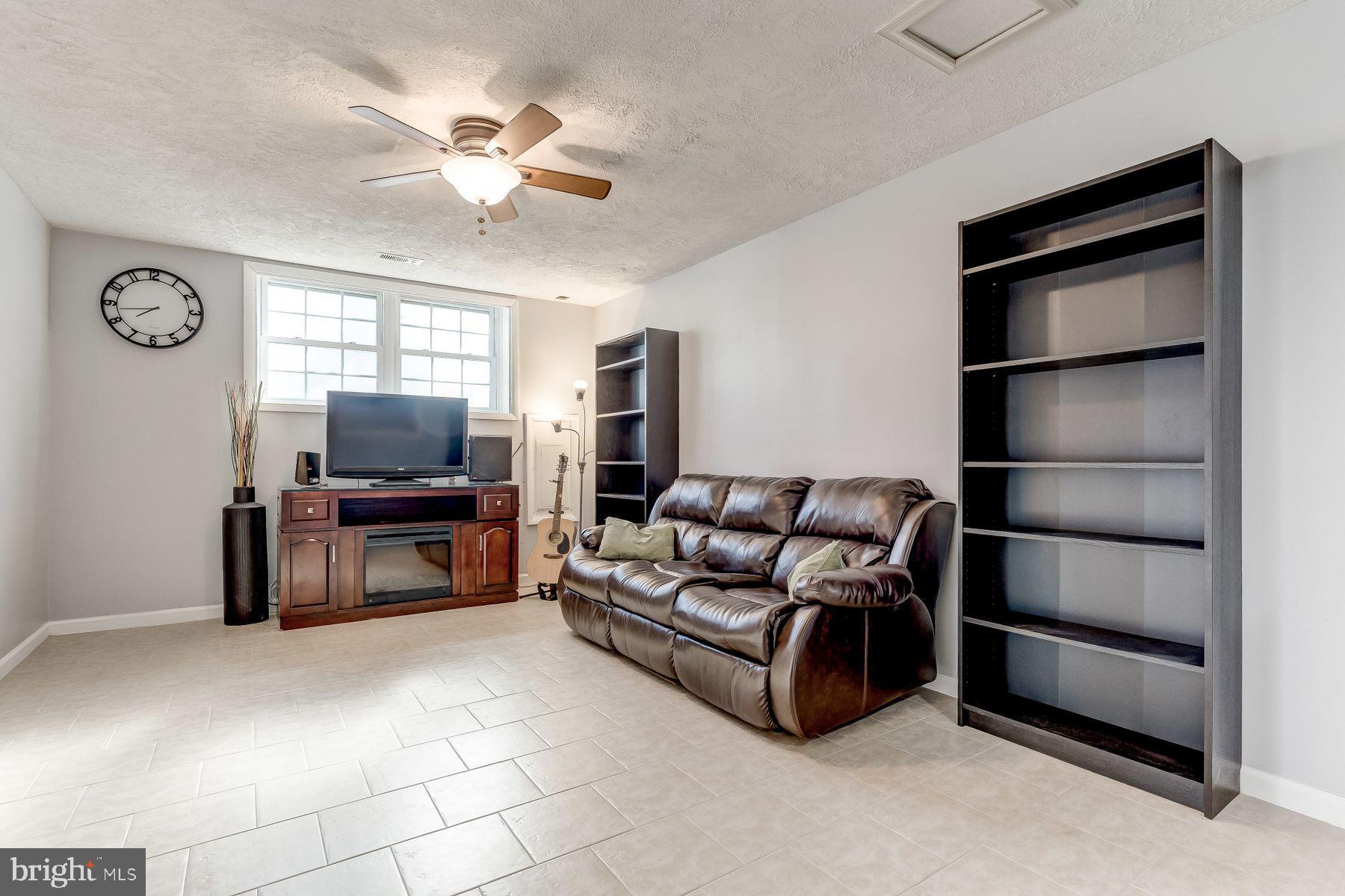 7471 Setting Sun Way Columbia, MD 21046 - Photo 15 of 20 Lower-level family room