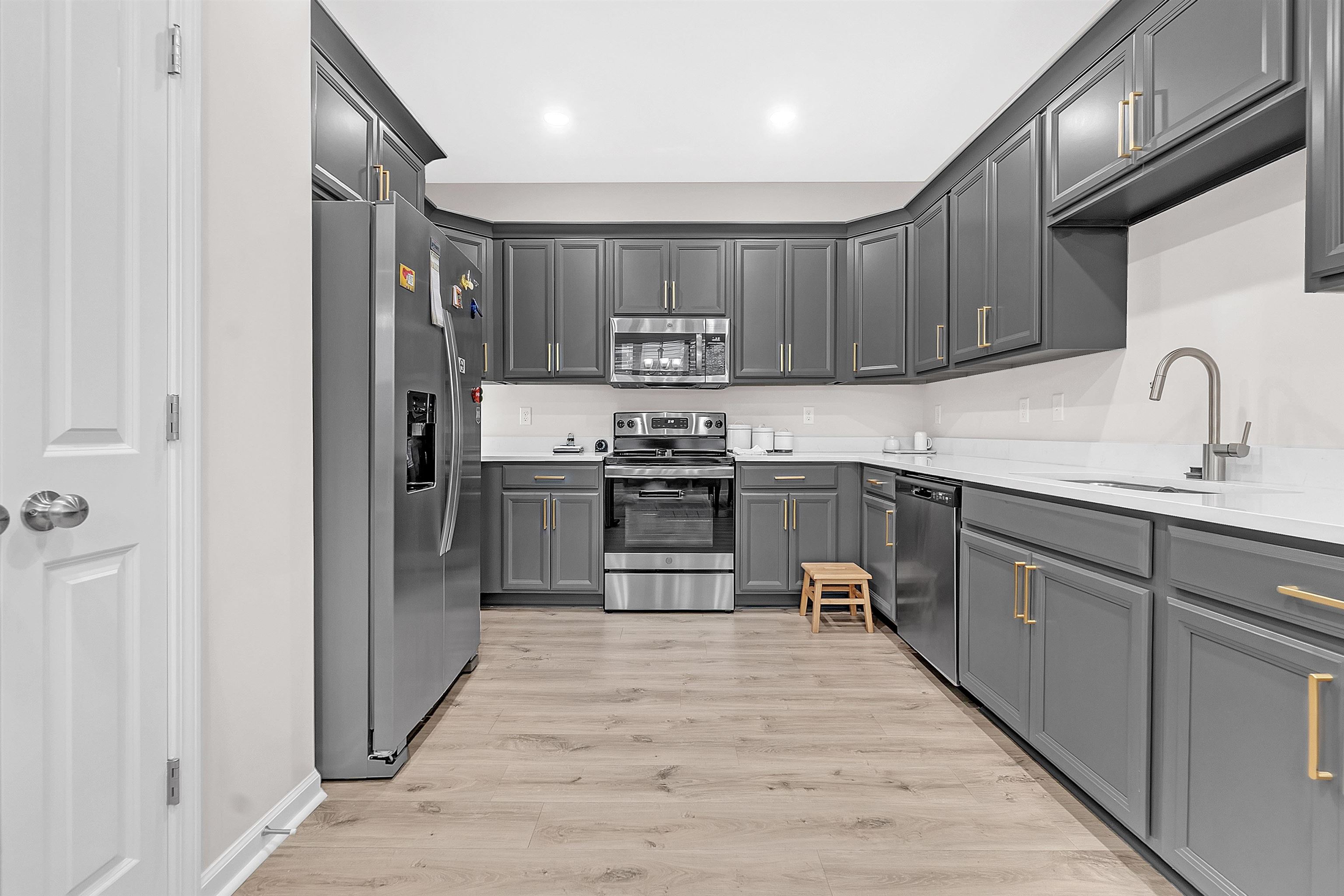 10151 Macon Road Cordova, TN 38018 - Photo 13 of 36 a kitchen with stainless steel appliances granite countertop a refrigerator and a sink