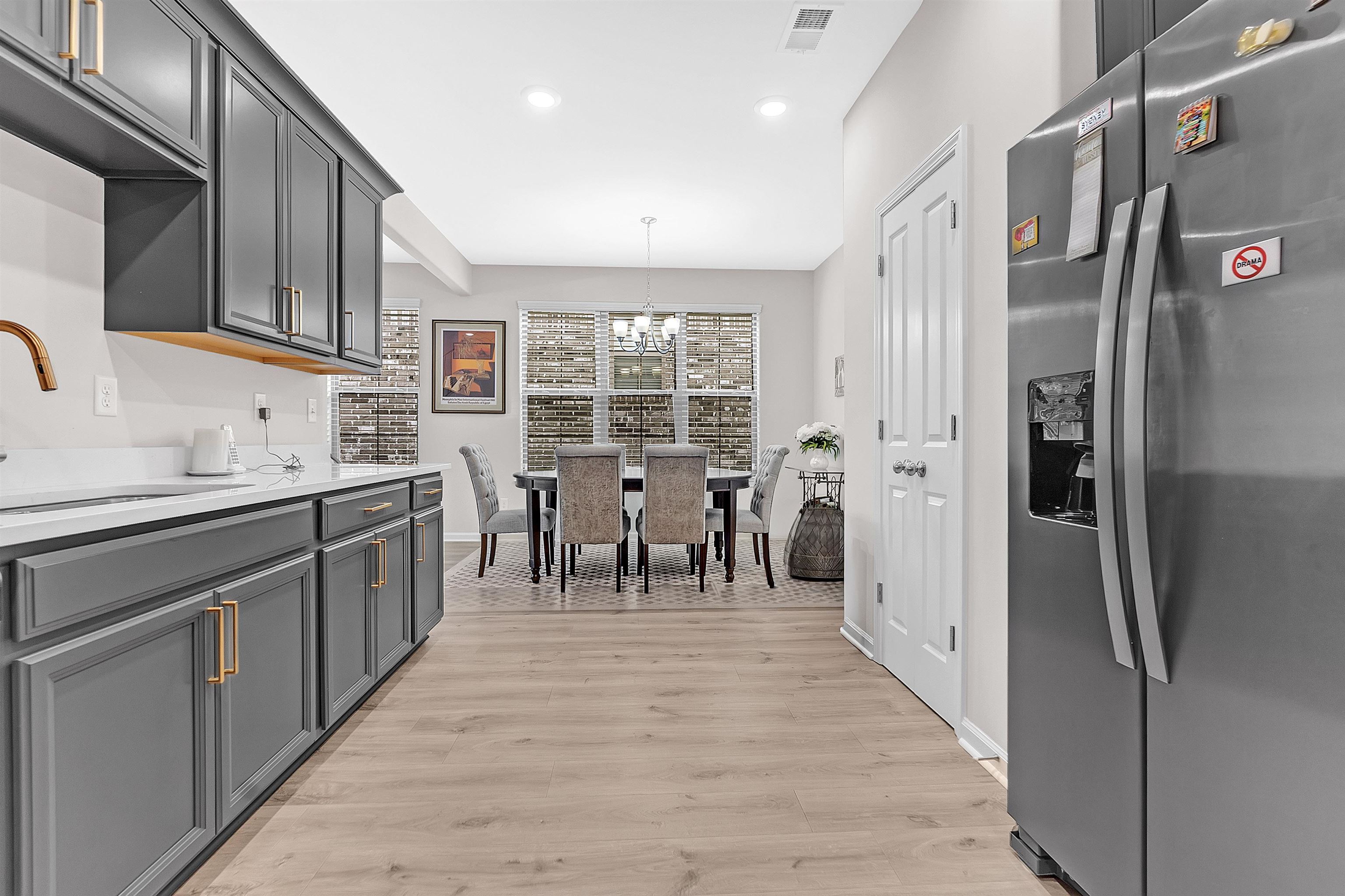 10151 Macon Road Cordova, TN 38018 - Photo 14 of 36 Kitchen featuring stainless steel fridge, a chandelier, light wood finished floors, pendant lighting, and recessed lighting