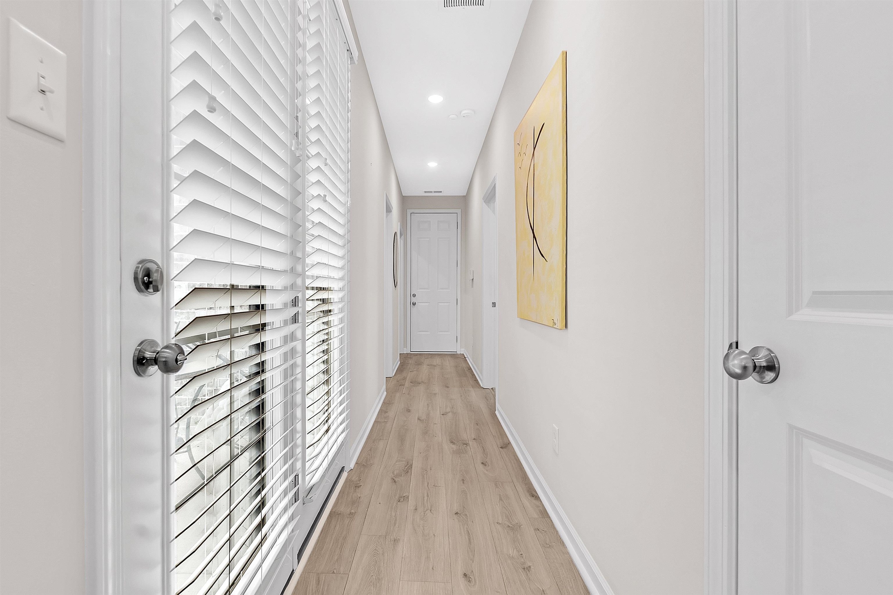 10151 Macon Road Cordova, TN 38018 - Photo 16 of 36 a view of a hallway with wooden floor and staircase