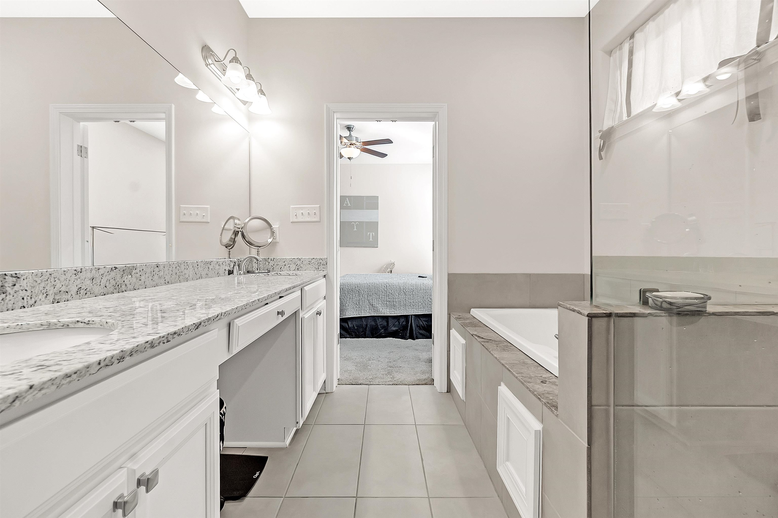 10151 Macon Road Cordova, TN 38018 - Photo 22 of 36 Full bath featuring vanity, light tile patterned floors, a garden tub, ensuite bathroom, and a ceiling fan