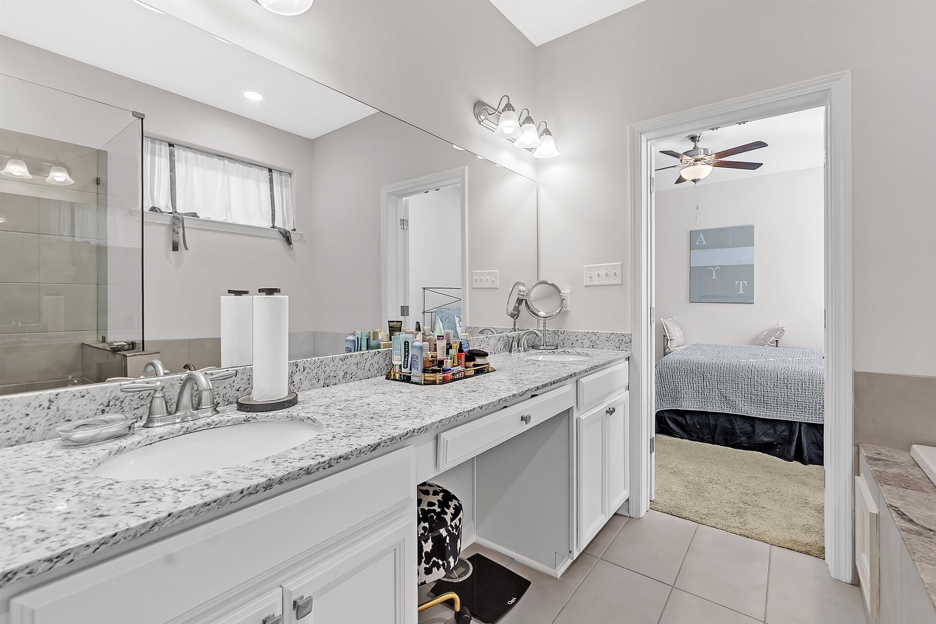 10151 Macon Road Cordova, TN 38018 - Photo 23 of 36 a en suite bathroom with double sink and a mirror
