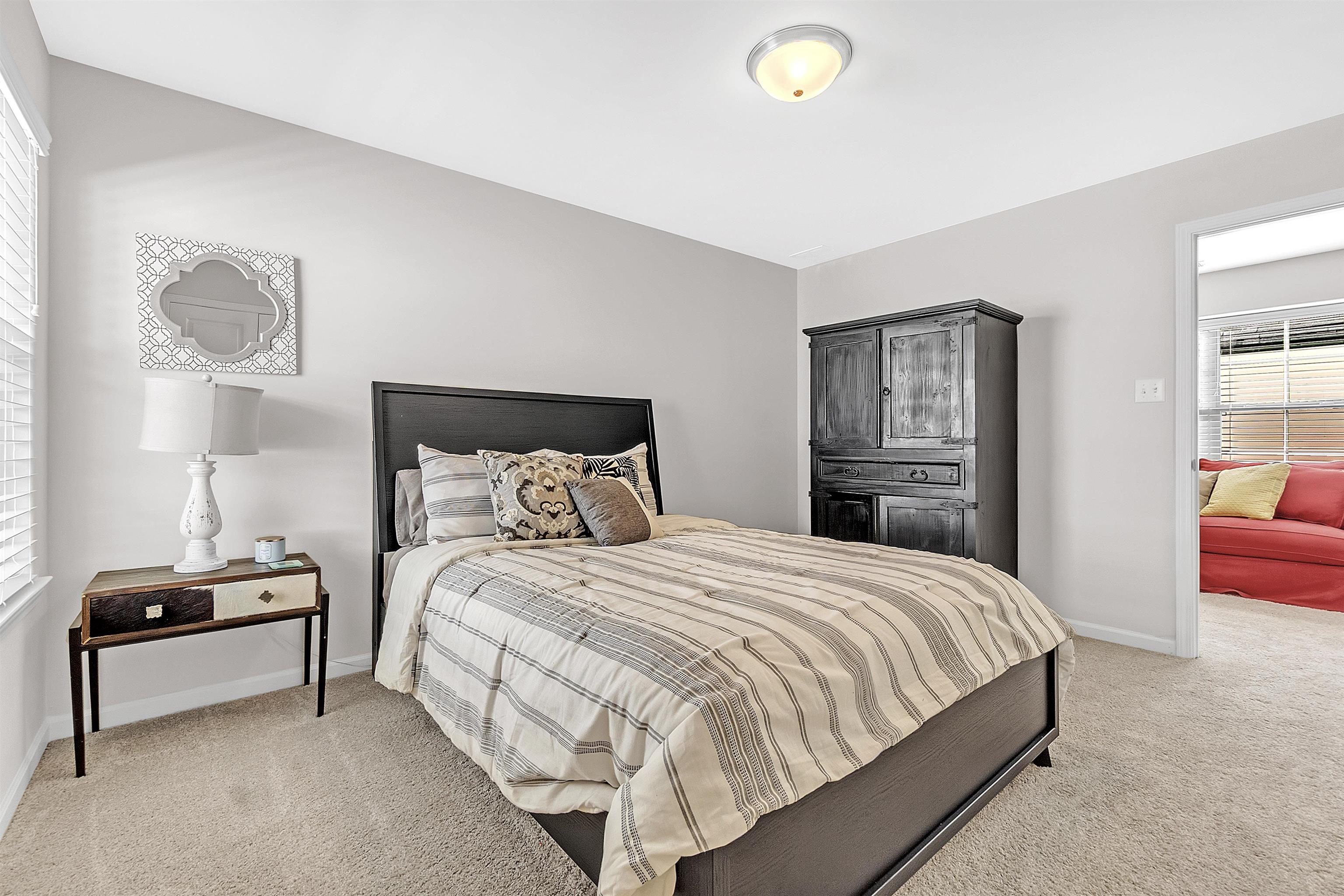 10151 Macon Road Cordova, TN 38018 - Photo 28 of 36 a bedroom with a bed and a view of kitchen