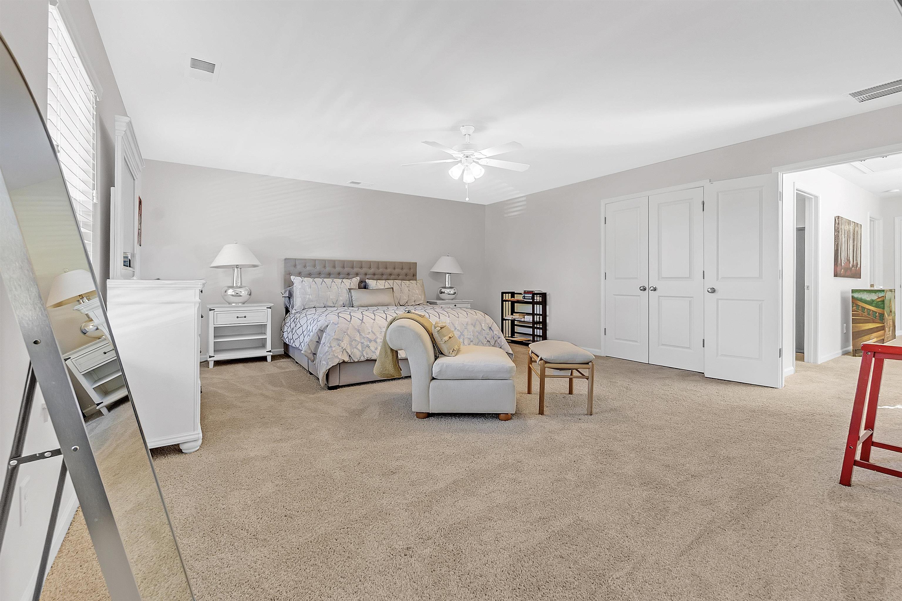 10151 Macon Road Cordova, TN 38018 - Photo 32 of 36 a spacious bedroom with a bed and a couch