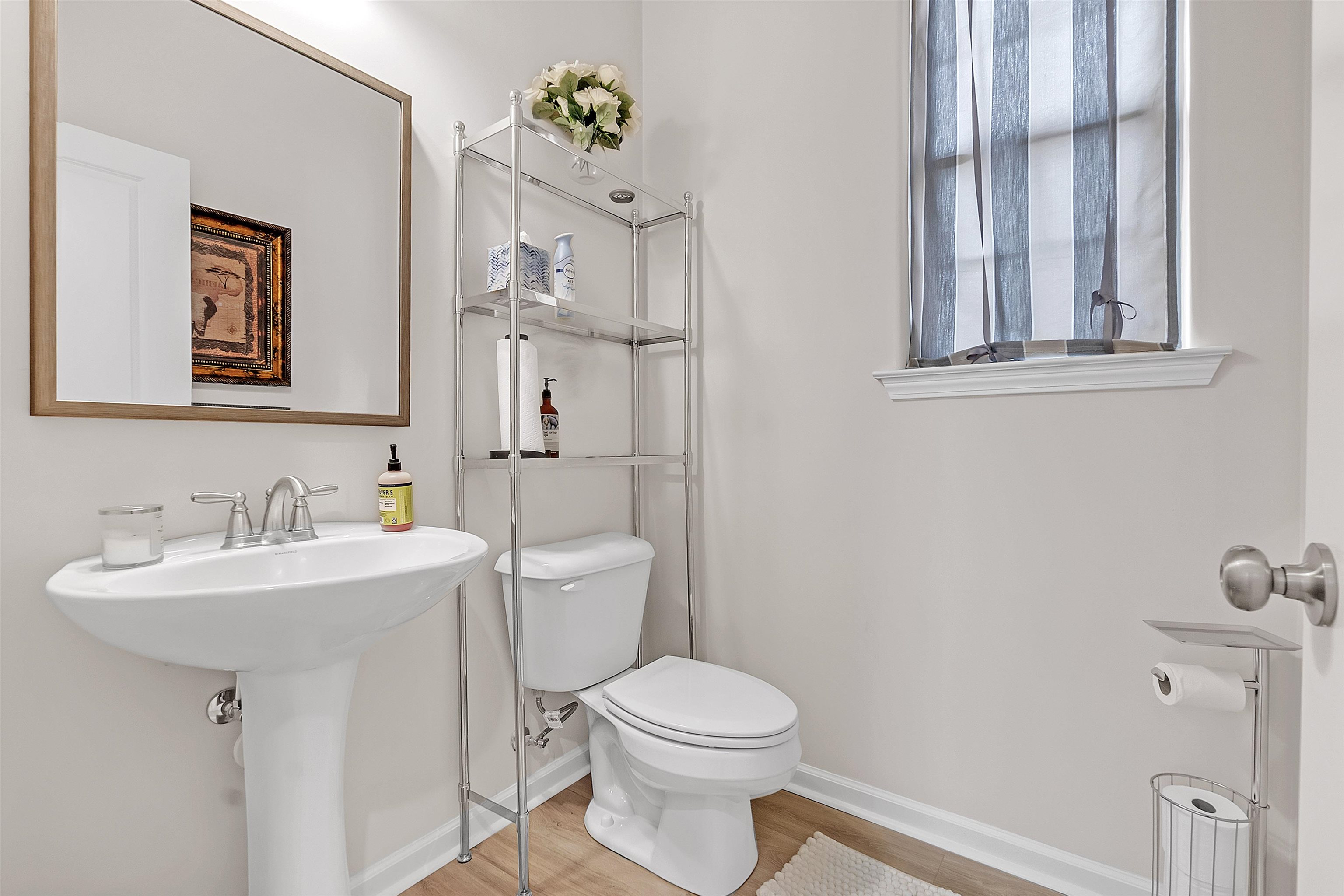 10151 Macon Road Cordova, TN 38018 - Photo 35 of 36 Half bathroom featuring baseboards and light wood-style floors