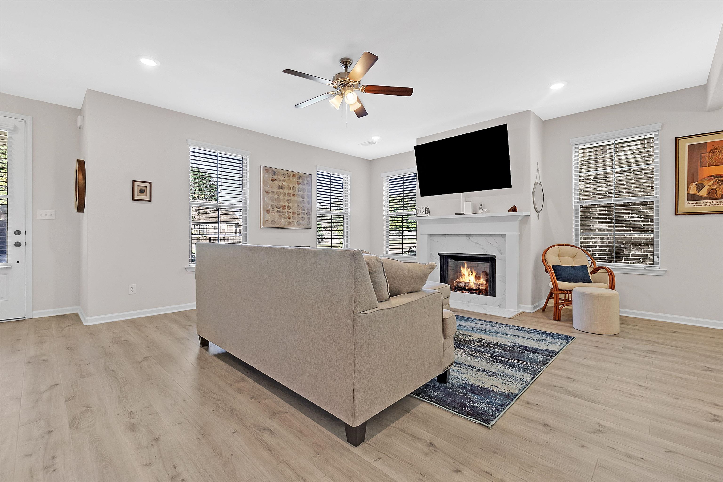 10151 Macon Road Cordova, TN 38018 - Photo 10 of 36 Living area featuring a high end fireplace, light wood-style floors, ceiling fan, and recessed lighting