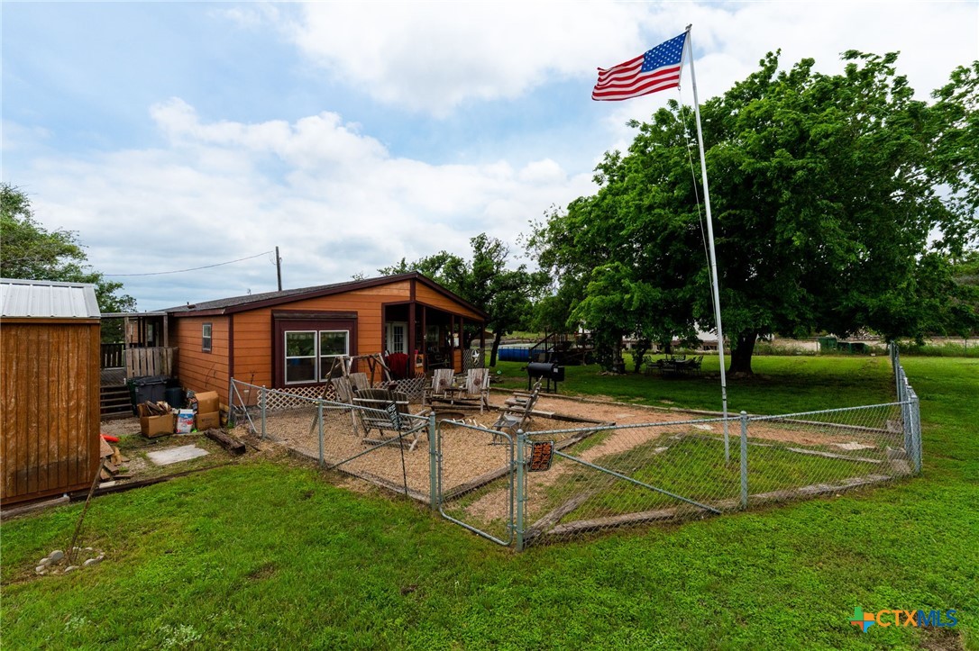 164 County Road 4450 Kempner, TX 76539 - Photo 2 of 44 a swimming pool with outdoor seating and yard