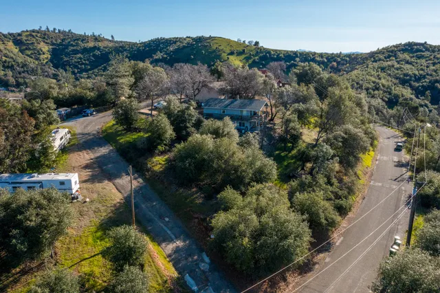 an aerial view of residential house with outdoor space
