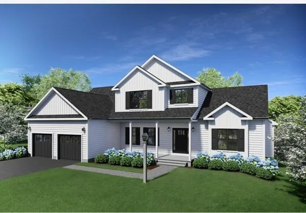 a front view of a house with a garden and yard
