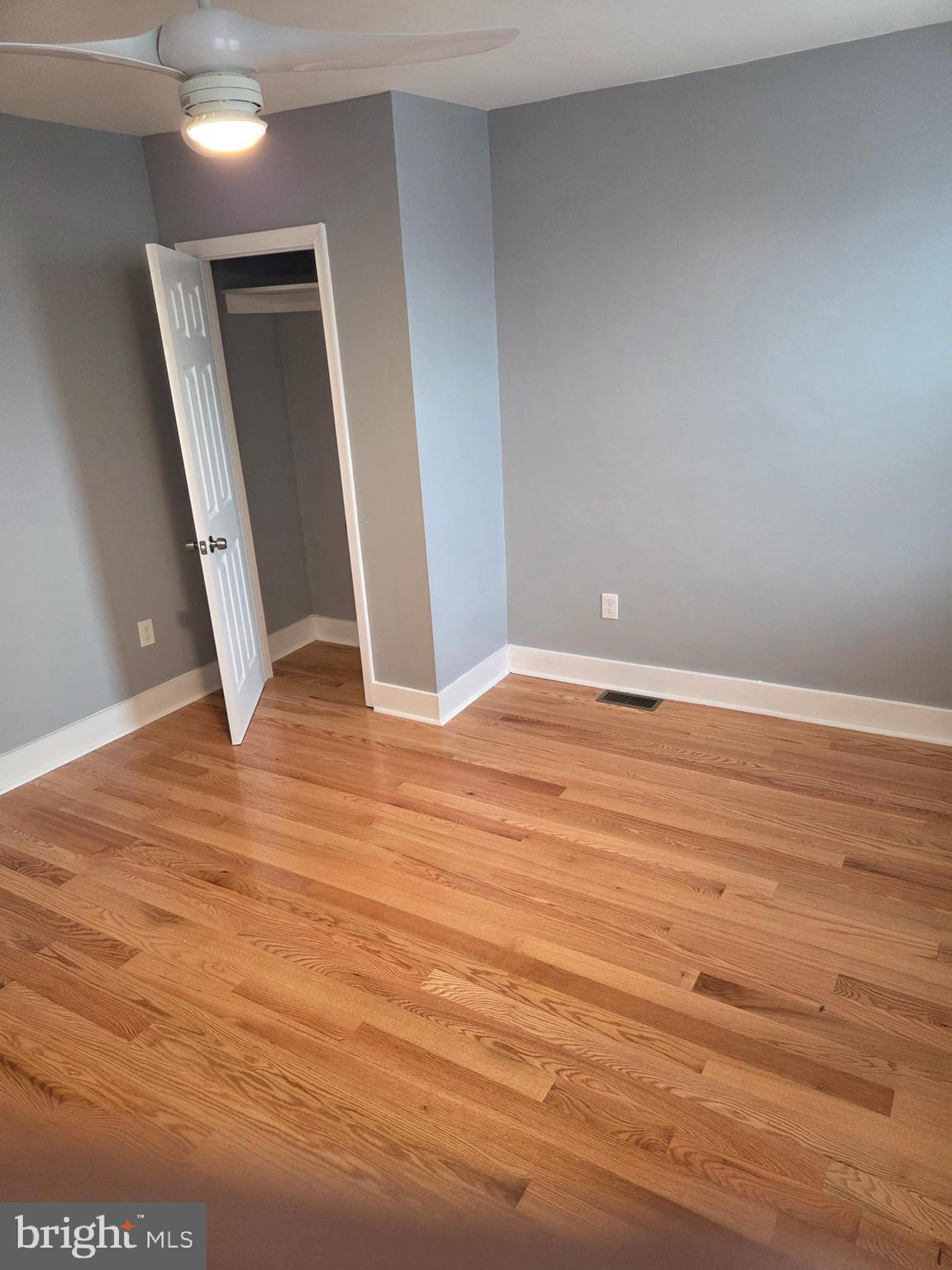 2609 East Hoffman Street Baltimore, MD 21213 - Photo 19 of 22 an empty room with wooden floor and entrance