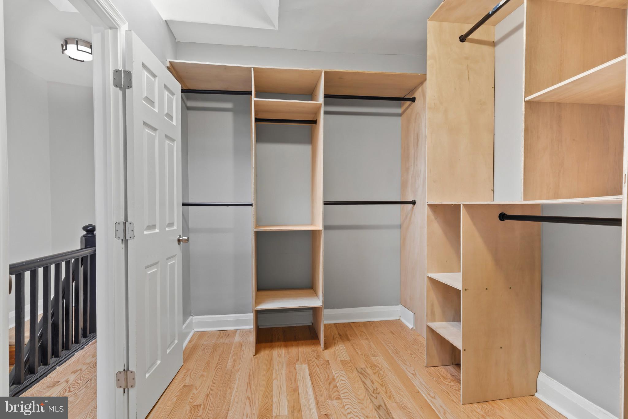 2609 East Hoffman Street Baltimore, MD 21213 - Photo 9 of 22 a view of walk in closet with empty racks