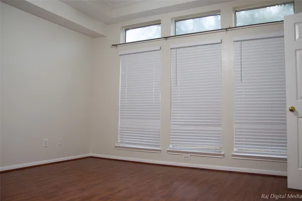 a view of a small space with wooden floor