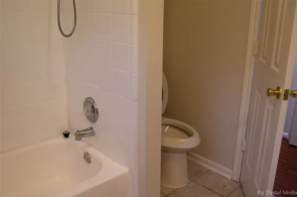 a bathroom with a granite countertop sink