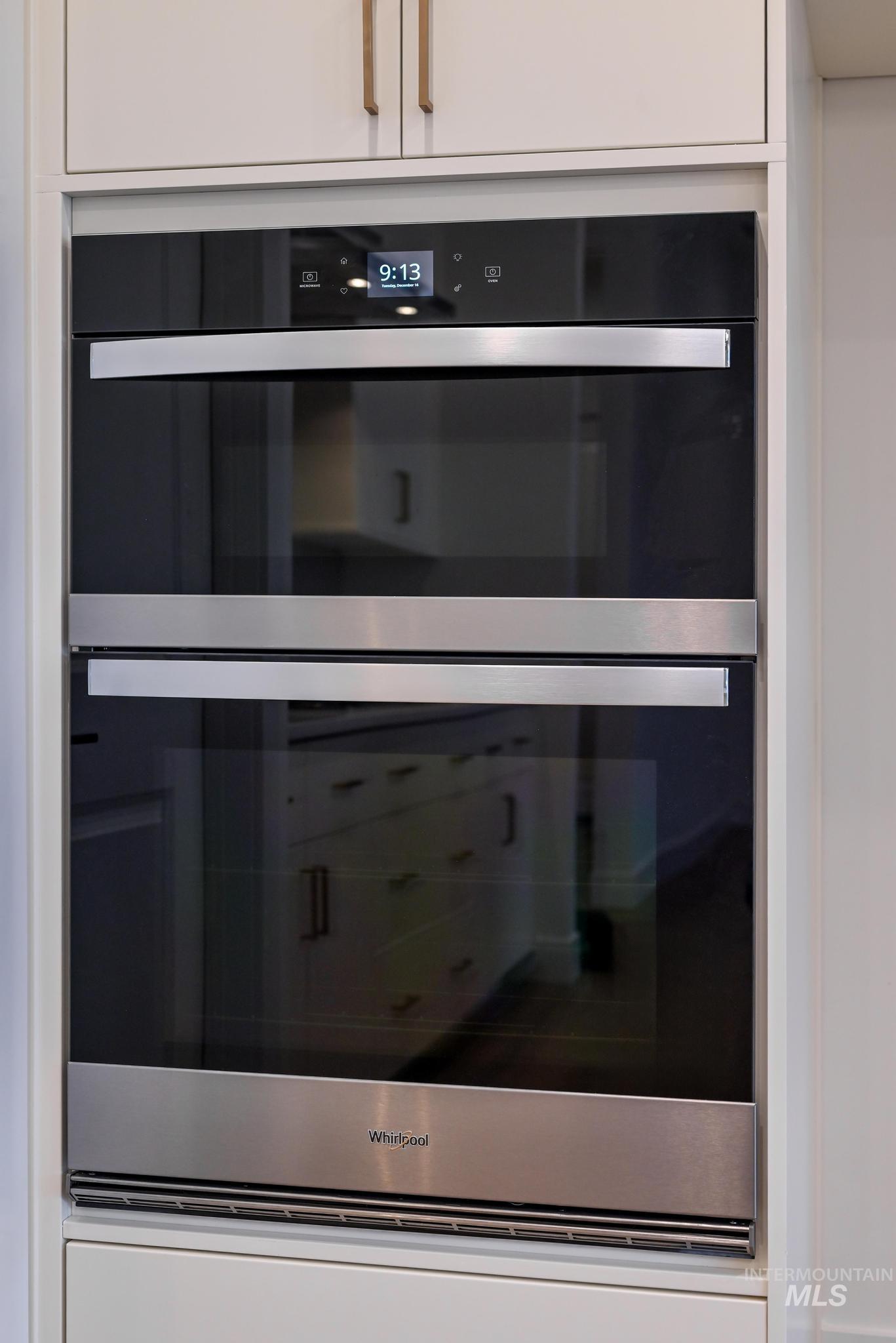 15142 Steel Cloud Avenue Caldwell, ID 83607 - Photo 13 of 44 Kitchen view of stainless steel double oven and white cabinets