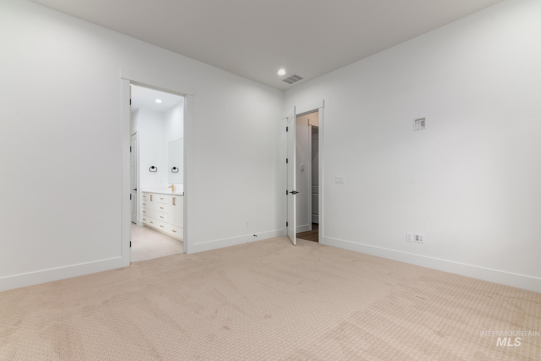 15142 Steel Cloud Avenue Caldwell, ID 83607 - Photo 18 of 34 Empty room featuring light carpet and recessed lighting