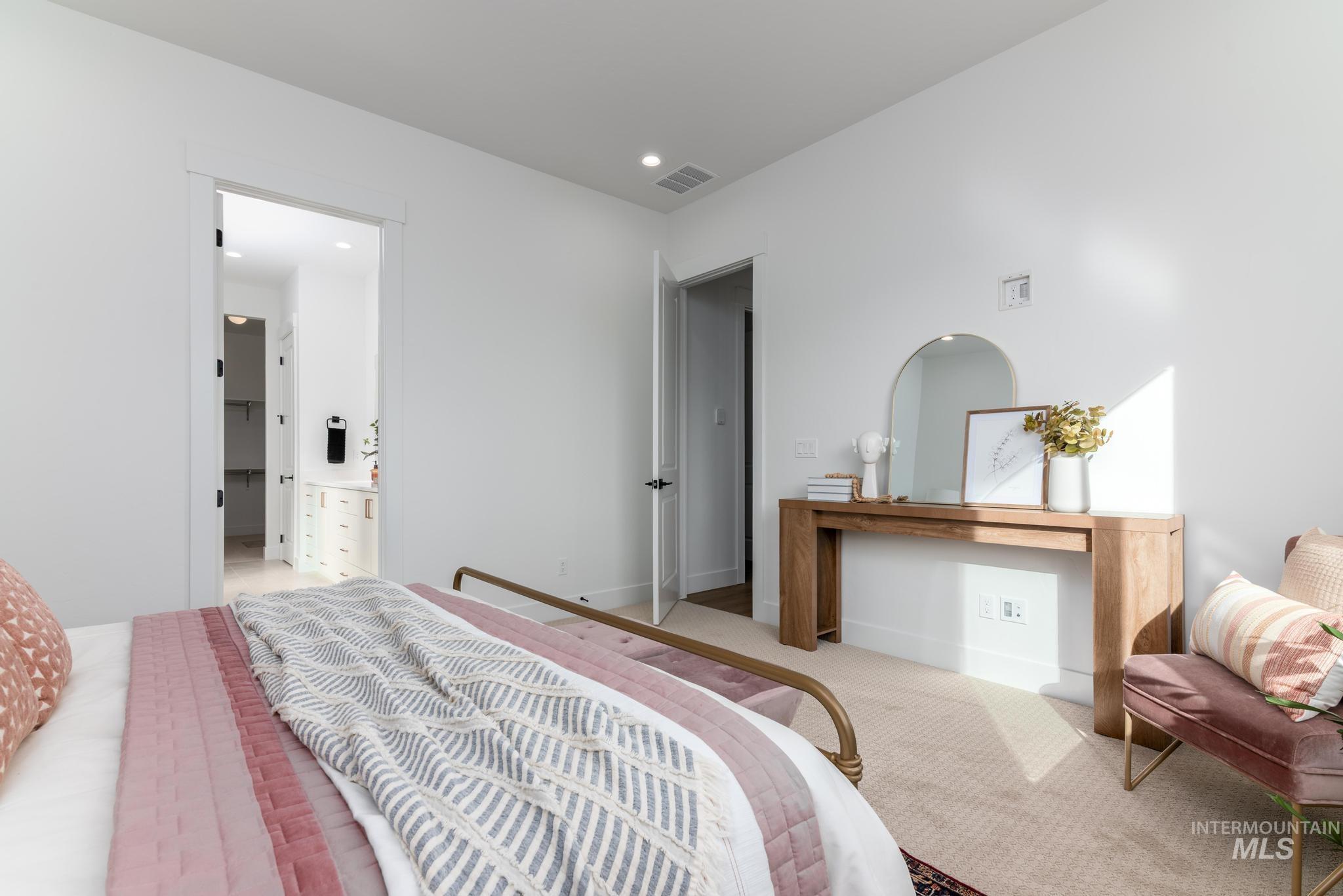 15142 Steel Cloud Avenue Caldwell, ID 83607 - Photo 20 of 44 Carpeted bedroom featuring connected bathroom and recessed lighting