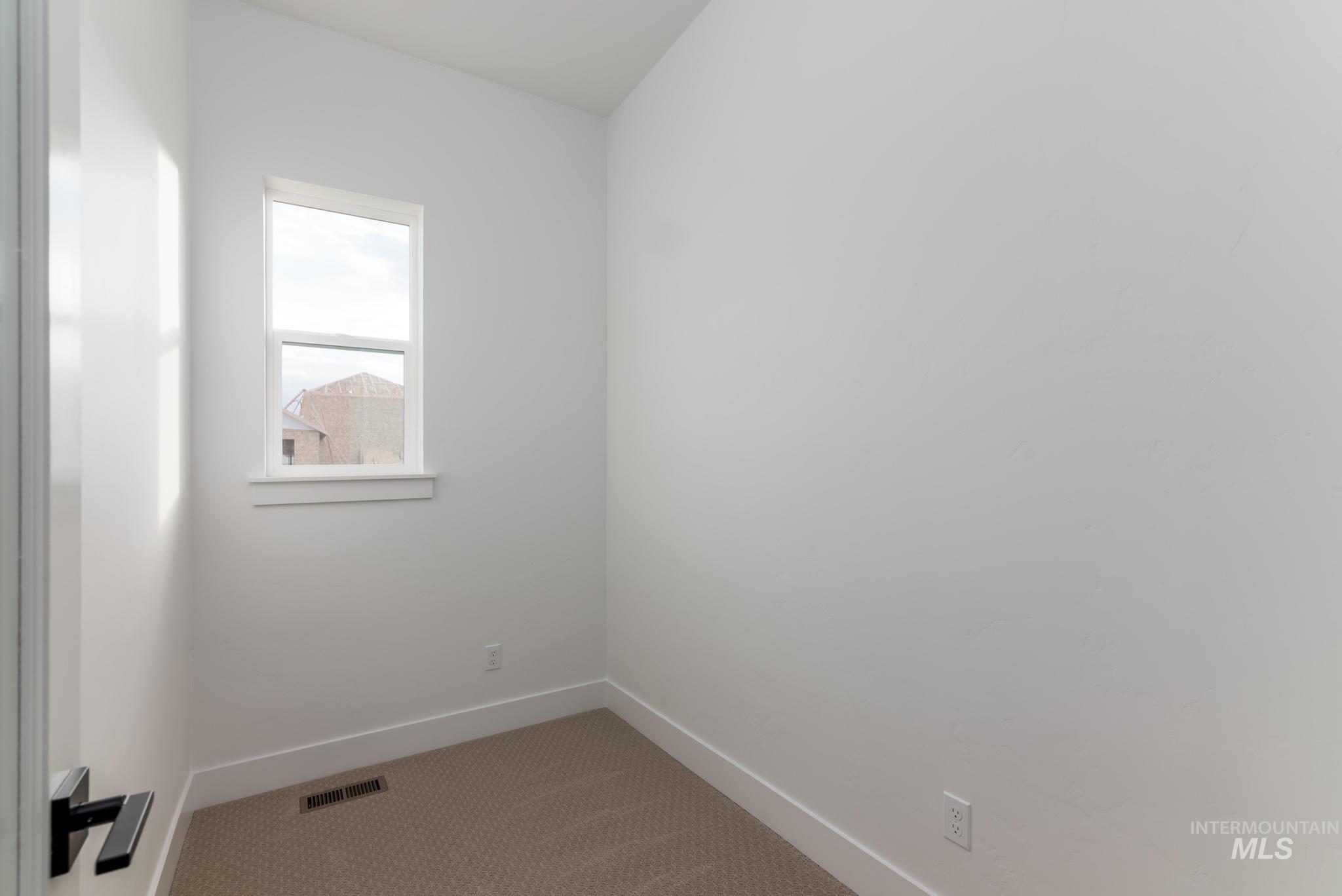 15142 Steel Cloud Avenue Caldwell, ID 83607 - Photo 22 of 34 Unfurnished room with baseboards and carpet floors