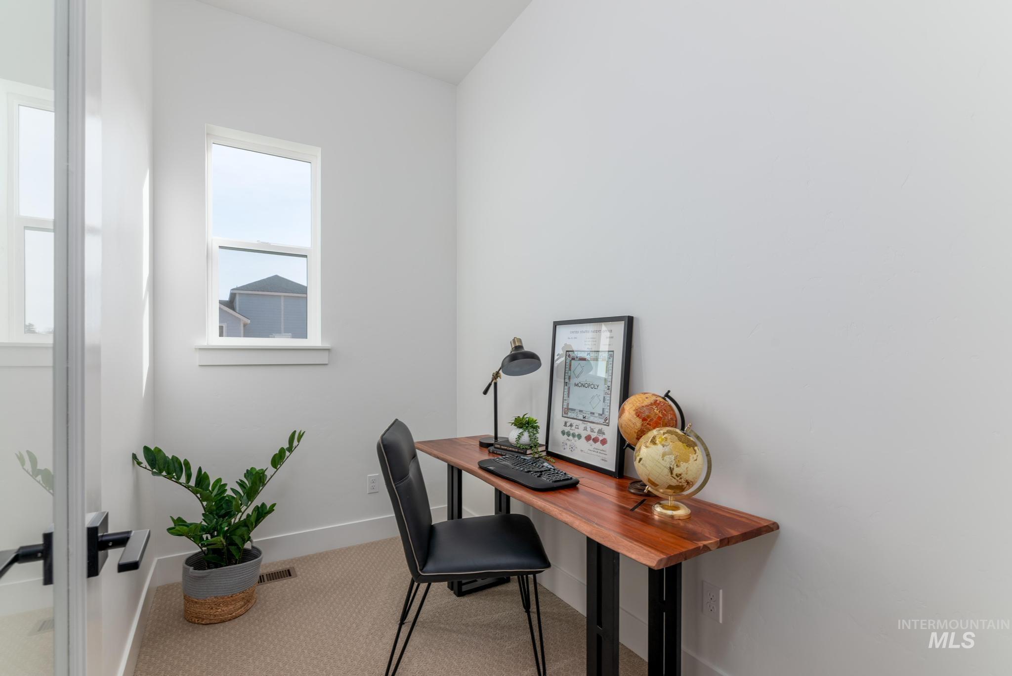 15142 Steel Cloud Avenue Caldwell, ID 83607 - Photo 24 of 44 Home office with carpet flooring and baseboards