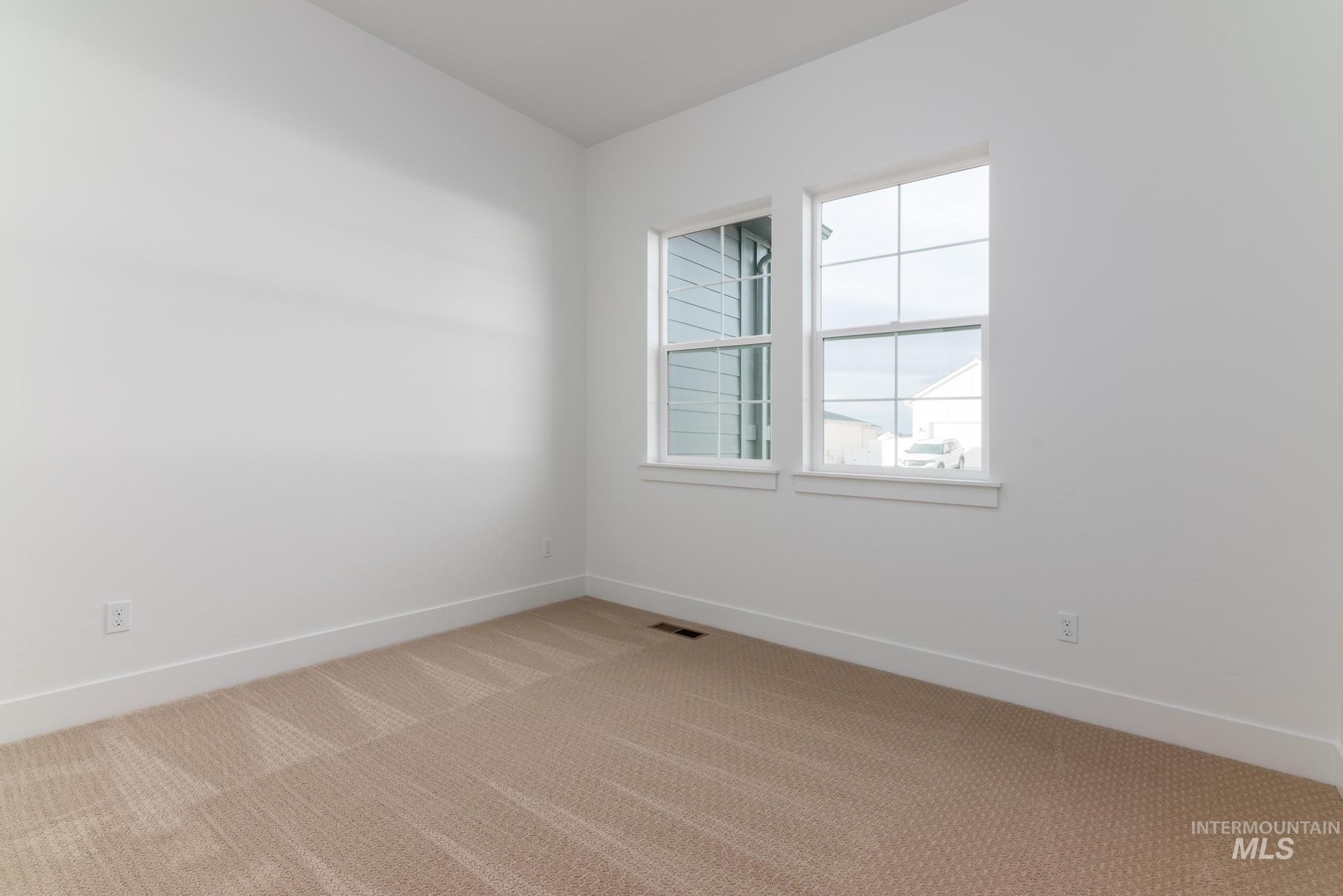 15142 Steel Cloud Avenue Caldwell, ID 83607 - Photo 25 of 44 Carpeted spare room featuring baseboards