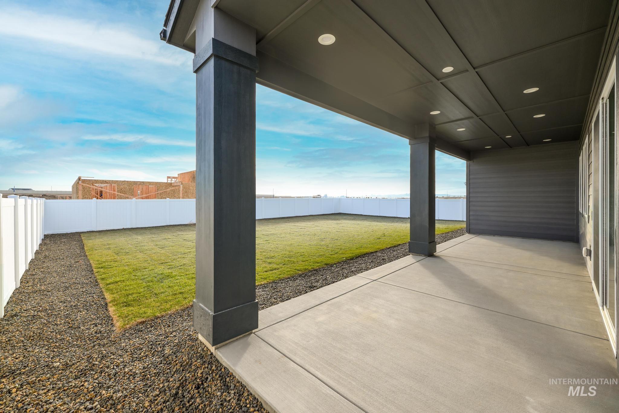 15142 Steel Cloud Avenue Caldwell, ID 83607 - Photo 30 of 34 Fenced backyard with a patio area