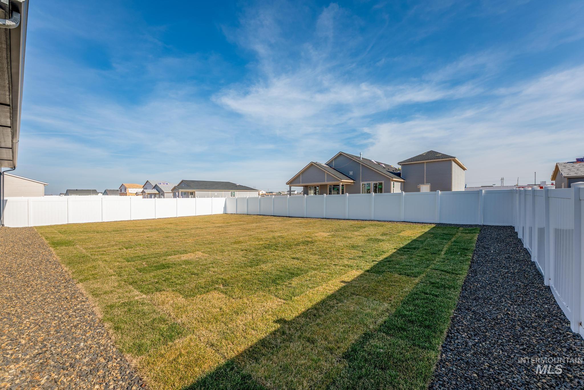 15142 Steel Cloud Avenue Caldwell, ID 83607 - Photo 35 of 44 Fenced backyard with a residential view