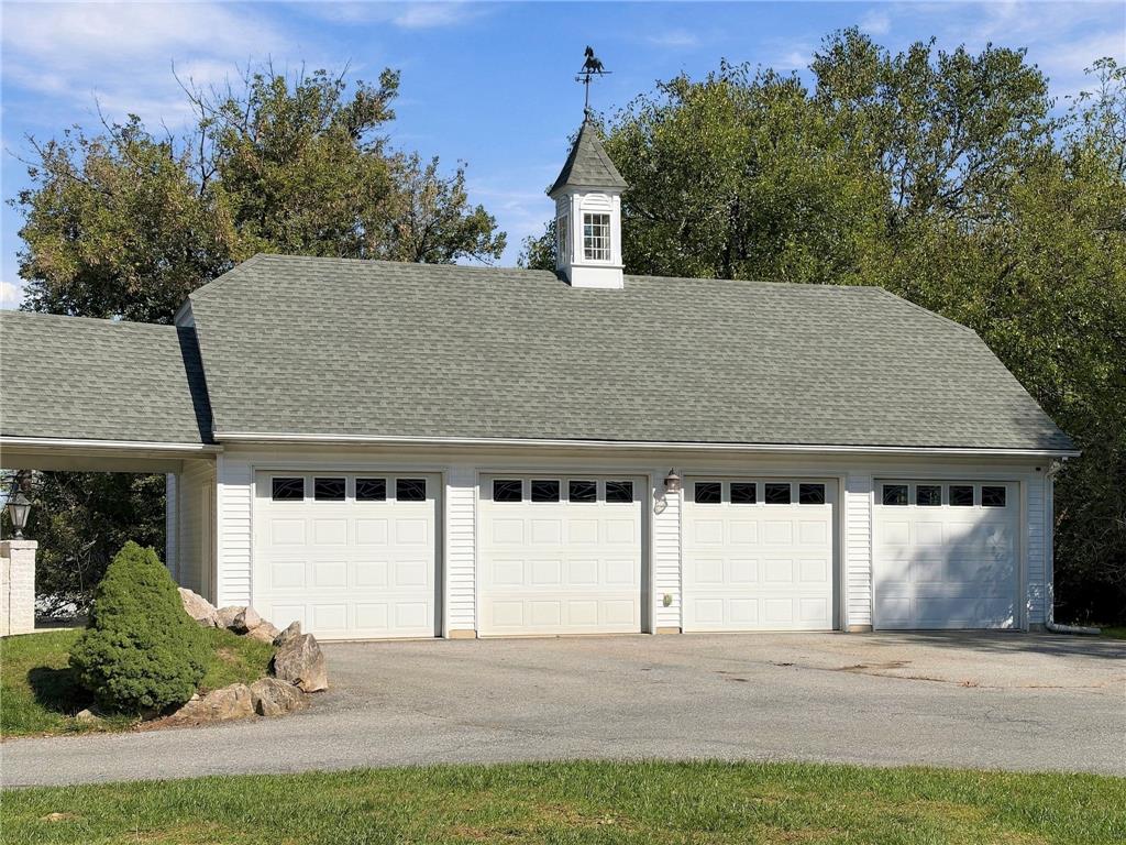 755 Yorkshire Road Allentown, PA 18103 - Photo 56 of 66 A spacious detached structure features four garage bays and a traditional cupola overhead.