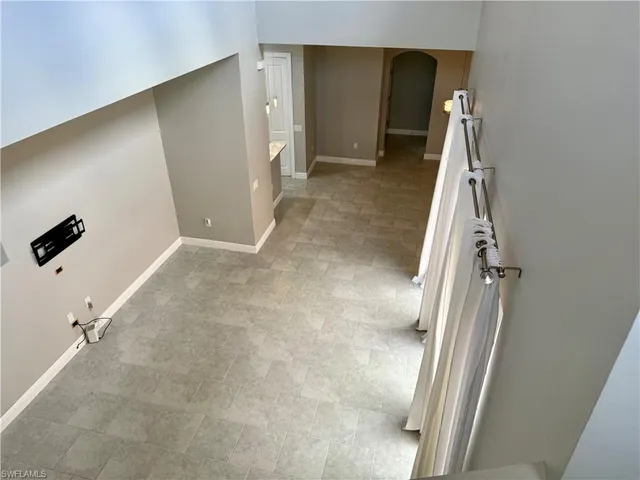 a view of a livingroom with stairs