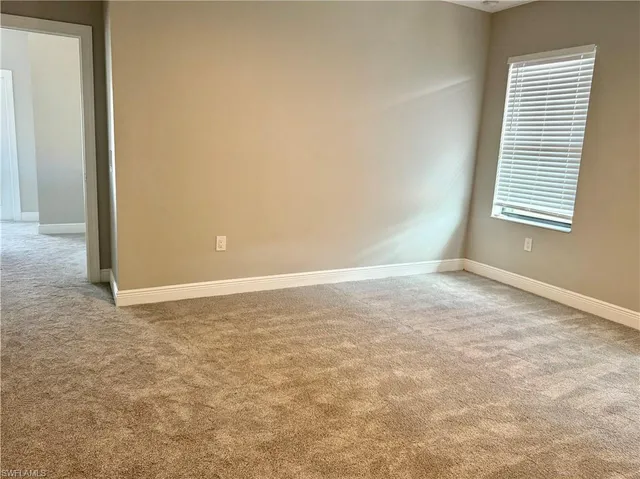 a bathroom with a shower and a door