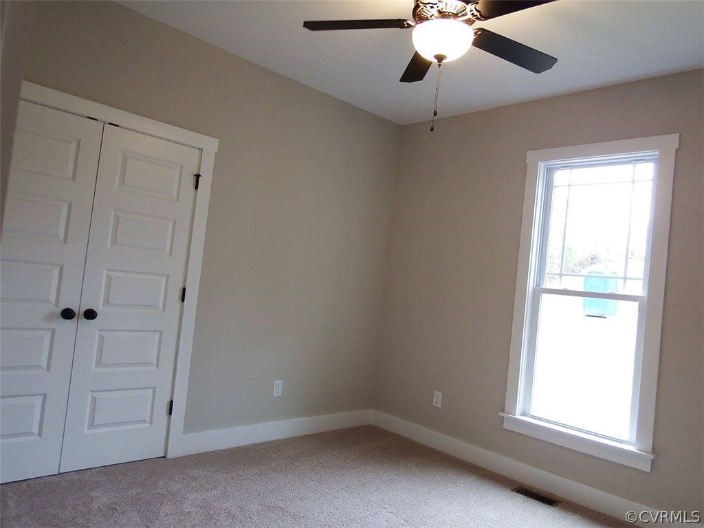 Lot 7 Jay's Road Farmville, VA 23901 - Photo 28 of 36 an empty room with a window and a chandelier fan