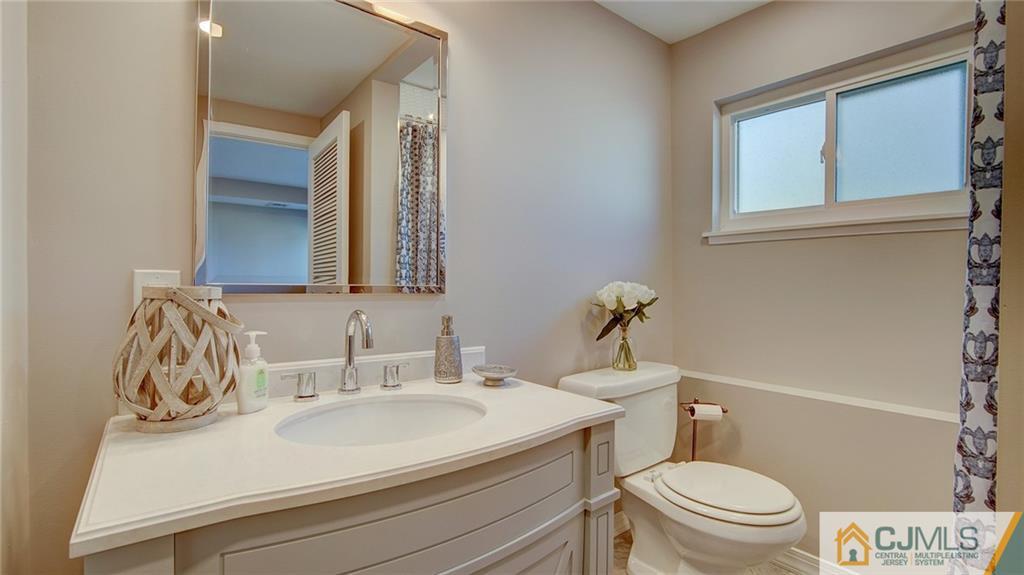 45 Middlesex Road Old Bridge, NJ 07747 - Photo 19 of 35 a bathroom with a sink toilet and mirror