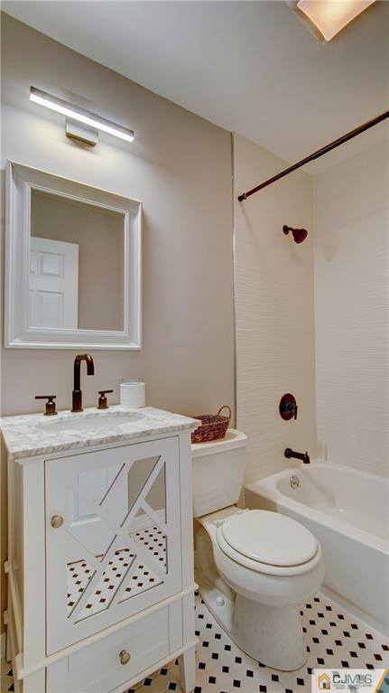 45 Middlesex Road Old Bridge, NJ 07747 - Photo 22 of 35 a bathroom with a sink a toilet and a mirror