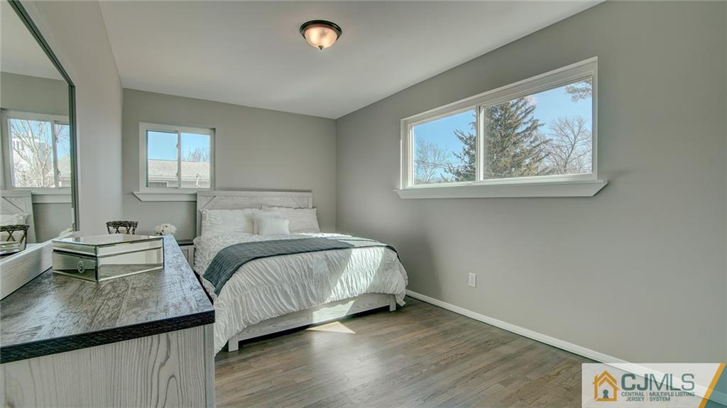 45 Middlesex Road Old Bridge, NJ 07747 - Photo 26 of 35 a bedroom with a bed and a painting on the wall