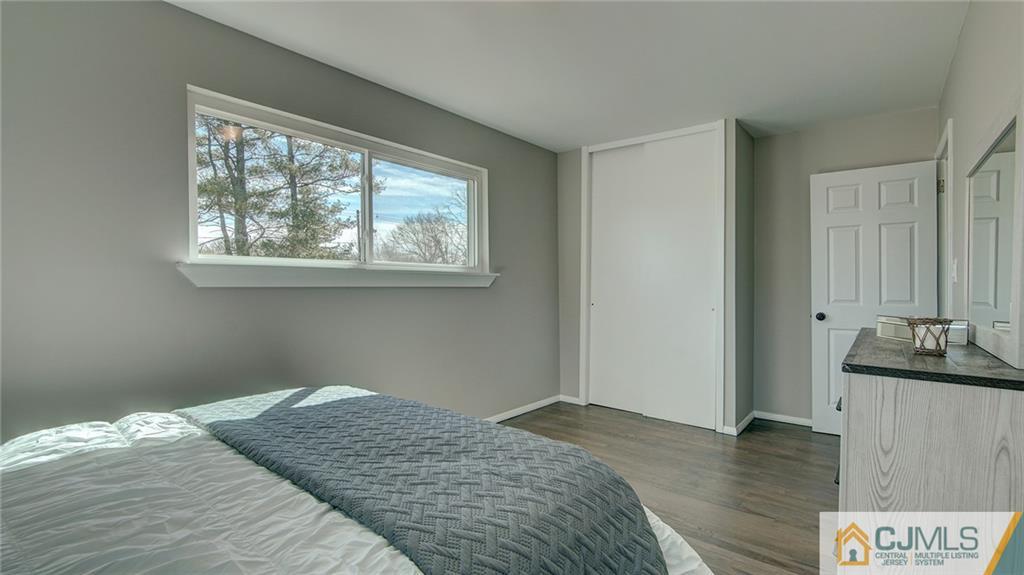 45 Middlesex Road Old Bridge, NJ 07747 - Photo 28 of 35 a bedroom with a bed and a wooden floor