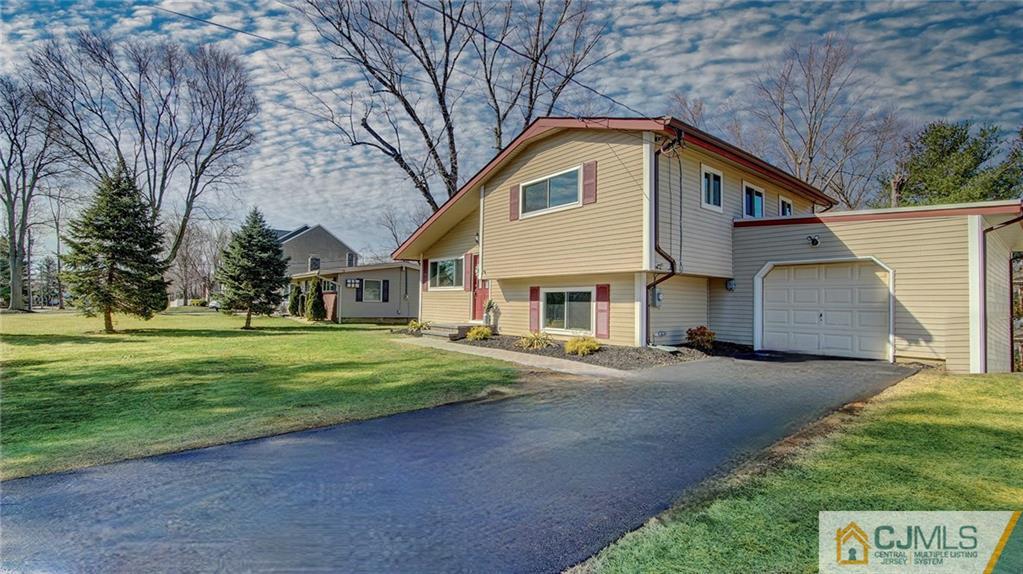 45 Middlesex Road Old Bridge, NJ 07747 - Photo 3 of 35 a front view of a house with a yard