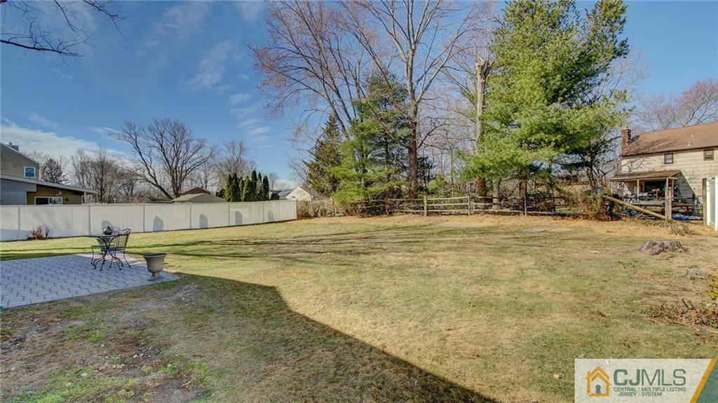 45 Middlesex Road Old Bridge, NJ 07747 - Photo 31 of 35 a view of swimming pool with lawn chairs and plants