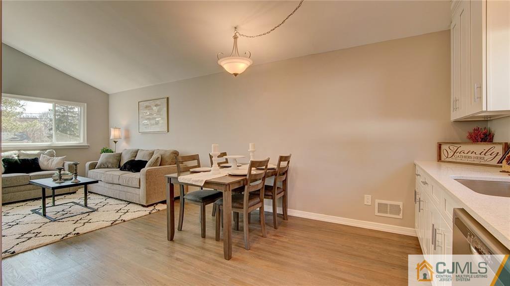 45 Middlesex Road Old Bridge, NJ 07747 - Photo 10 of 35 a living room with furniture a fireplace and a window