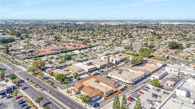 an aerial view of a city with parking