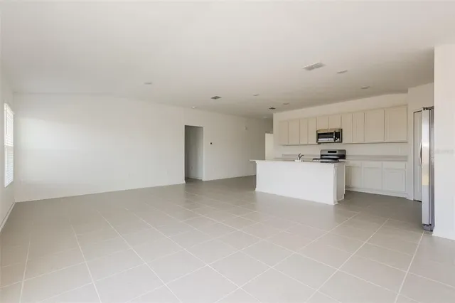 a view of kitchen with white cabinets