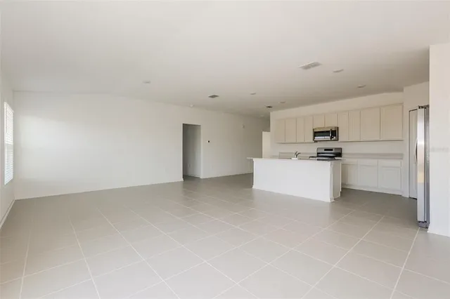 a view of kitchen with white cabinets