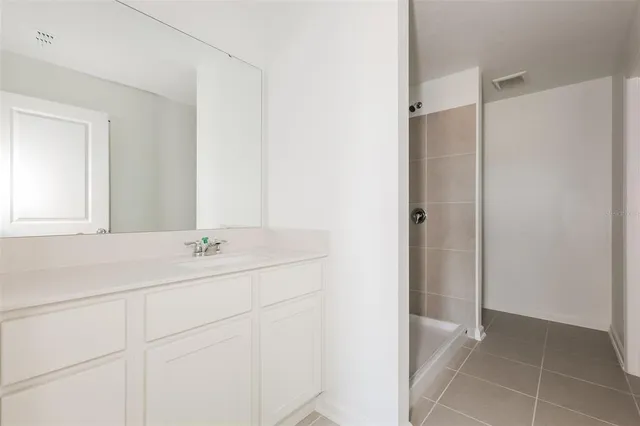 a bathroom with a sink and vanity