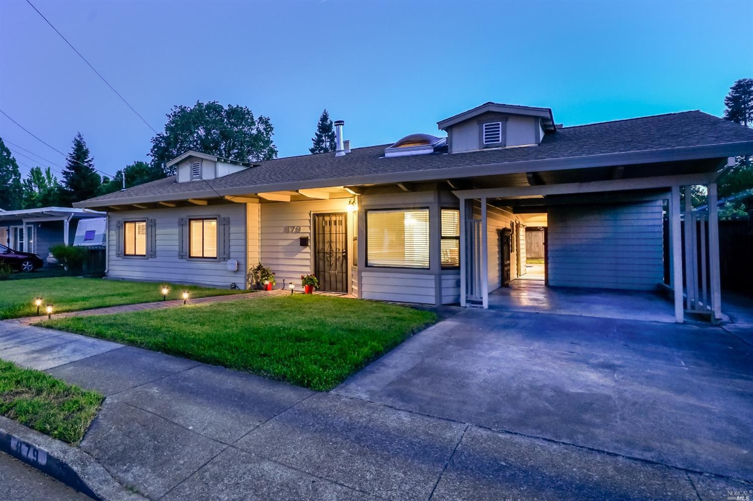 879 Yulupa Avenue Santa Rosa, CA 95405 - Photo 1 of 1 a front view of a house with garden