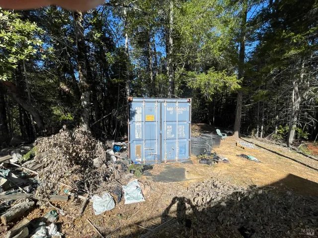 a view of a backyard of the house