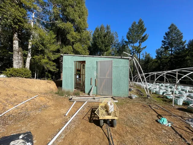 a view of a backyard with sitting area