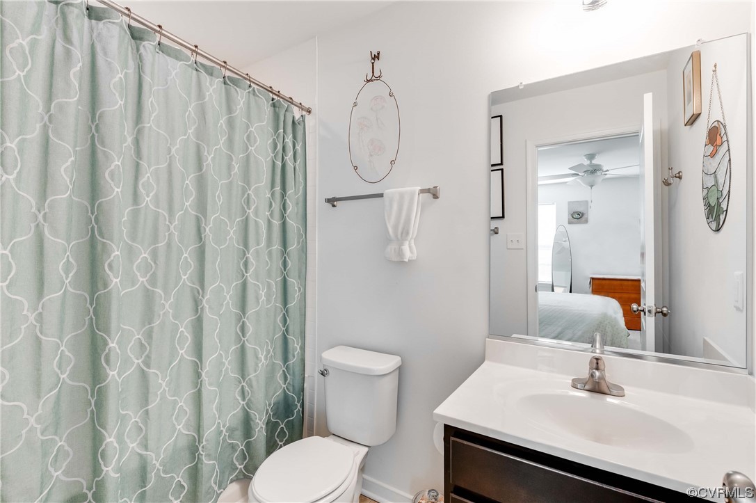 1314 Stone Rdg Pk Loop Henrico, VA 23228 - Photo 14 of 20 Bathroom featuring shower curtain, large vanity, mirror, and toilet