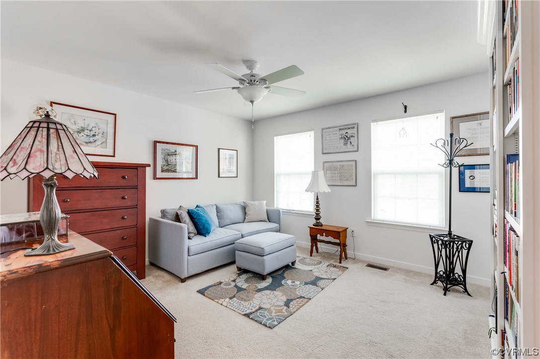 1314 Stone Rdg Pk Loop Henrico, VA 23228 - Photo 2 of 20 Carpeted living room featuring a healthy amount of sunlight and a ceiling fan